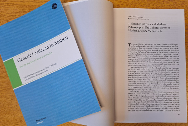 Two copies of the same book. On the left is the cover.  On the right is the page open to the essay.